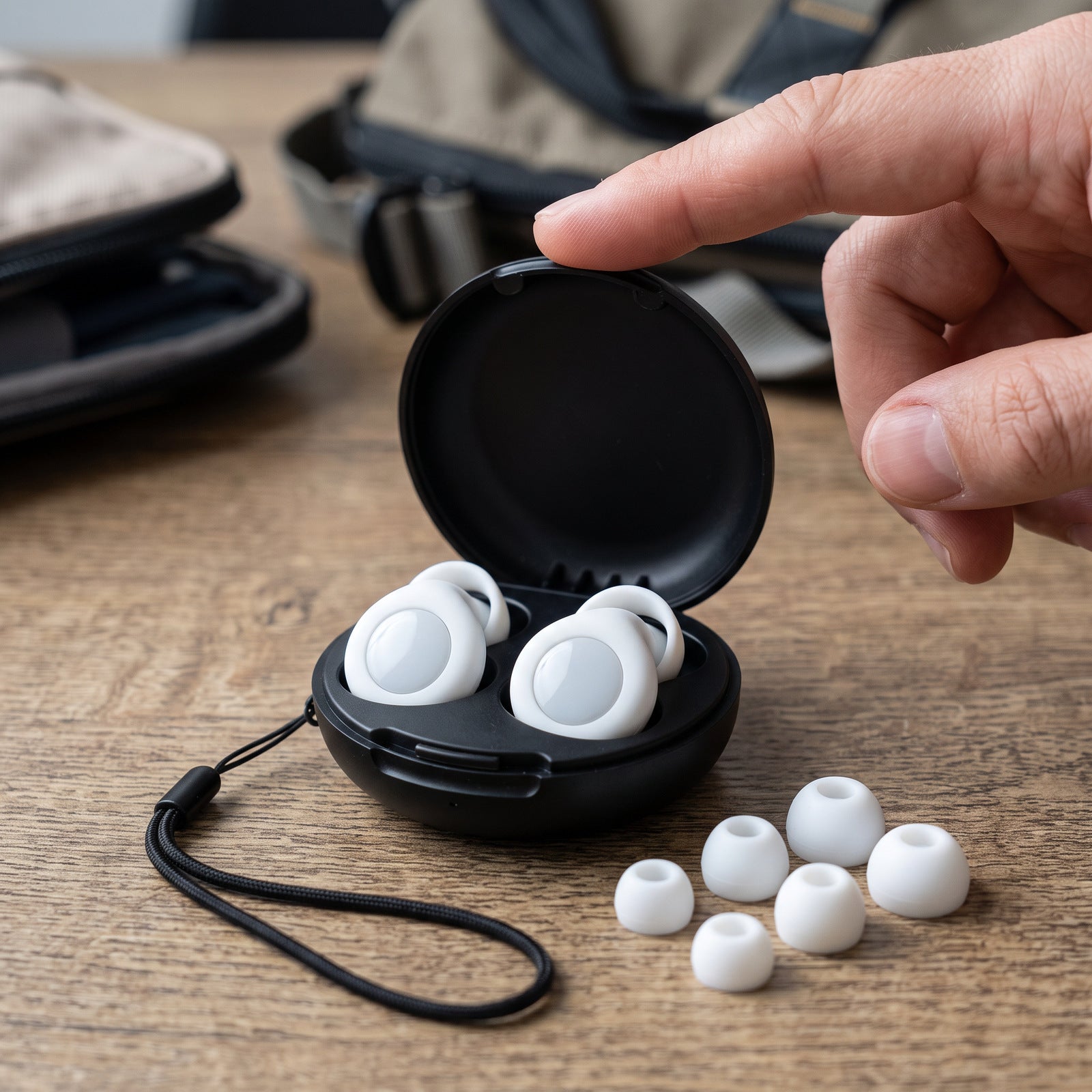 White pair in open case with spare tips on a packing table